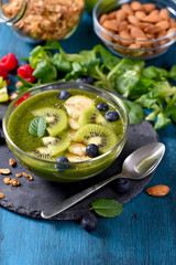 Smoothie bowl, green smoothie with berries, healthy breakfast, vegan vitamin snack