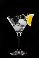 Foto op Plexiglas A glass with vermouth and ice cube on a black background © Yaruniv-Studio