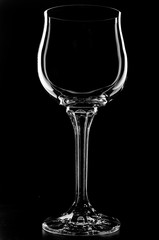 A glass of wine on a black background