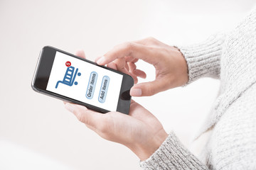 Hand touching online shopping on mobile application e-commerce with smart phone.sale and promotion marketing  business concept.