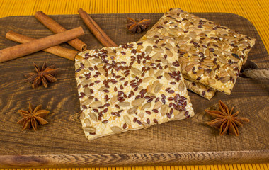 Cookies on the board with spices, cinnamon, star anise. Bamboo canvas.