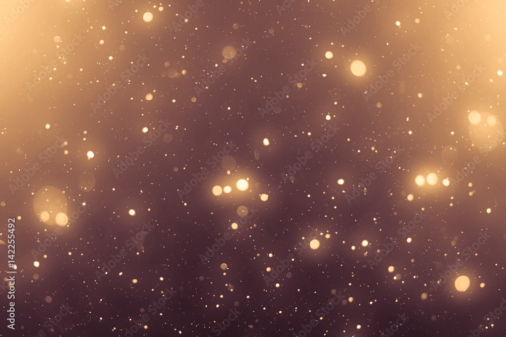 Poster golden abstract sparkles or glitter lights. festive gold background. defocused circles bokeh or part