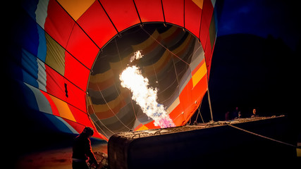 Cappadocia, Turkey - November 15, 2014:  Hot Air Balloon being hot air filled with flames