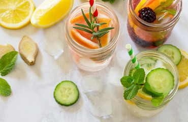 Fruit refreshing water. Summer cold drinks with blackberries, grapefruit, lemon and mint. The concept of healthy and dietary nutrition. Copy space.