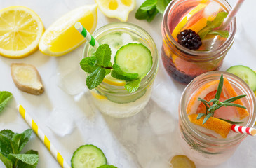 Fruit refreshing water. Summer cold drinks with blackberries, grapefruit, lemon and mint. The concept of healthy and dietary nutrition. Copy space.