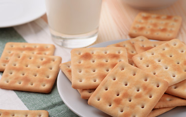 Still life with soda crackers and milk