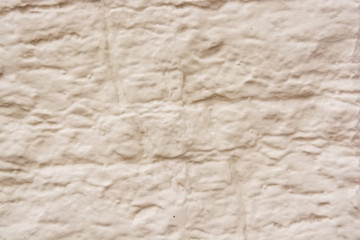 Close up beige old plaster texture background
