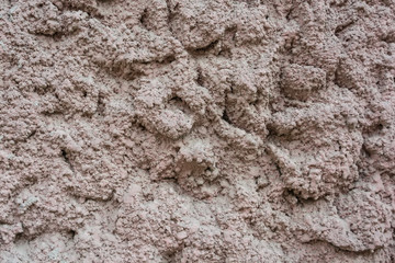 Close up uneven plaster surface texture background