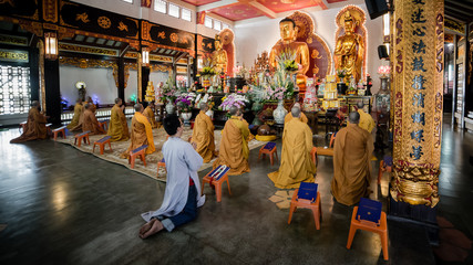 Ho Chi Minh City, Vietnam - November 27, 2015 - People praying in the buddhist temple Vinh Nghiem