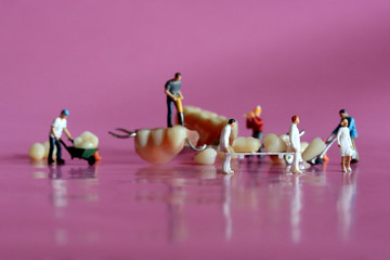 Miniature Workers Performing Dental Procedures. Dental Office Art.