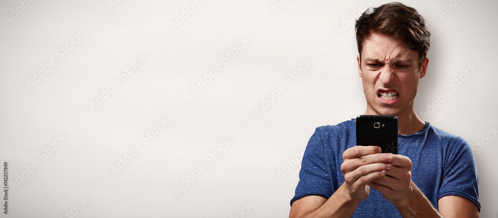 Canvas Prints Angry man with smartphone