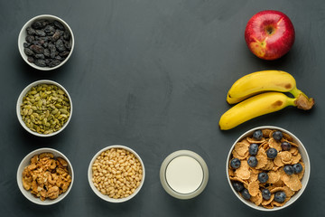 Healthy food. Milk, multi grain flakes with blueberry, nuts and fruits for breakfast.