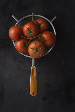 Whole tomatoes in seive 