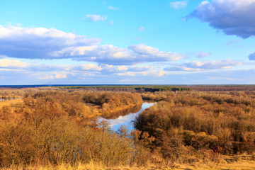 Typical landscape of Central Russia in the spring. The river among the trees on the plain.