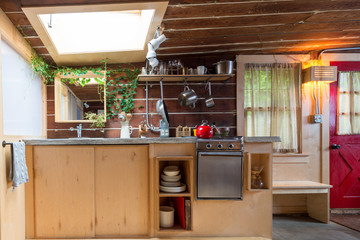 Rustic kitchen in a bright cabin. Interior design.