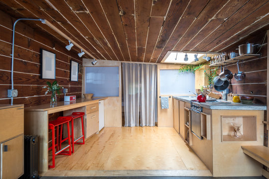 Rustic kitchen in a bright cabin. Interior design.