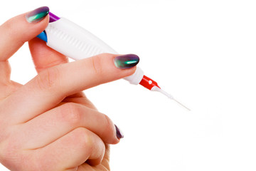 Woman holding toothbrush special for braces