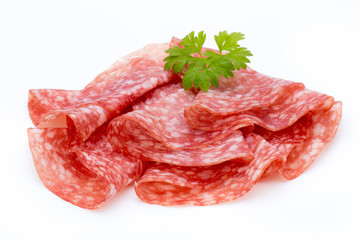 Salami smoked sausage slices isolated on white background cutout.