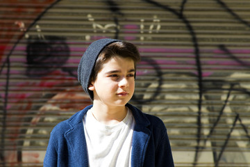 Fototapeta premium child in the street of the city, urban style outdoor