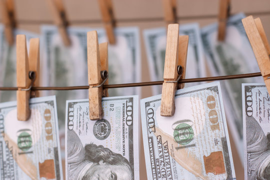 New cash bills are dried on the clothesline