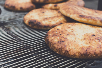 Freshly baked pitas at country fair outdoors