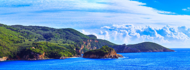 Naklejka premium Beautiful summer panoramic seascape. View of the coastline into the sea bays with crystal clear azure water. Paleokastrica. Corfu. Greece.