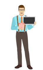 Businessman holding a piggy bank and digital tablet