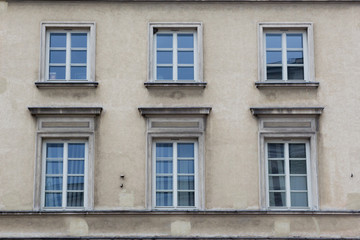 Six vintage design windows on the facade of the old house