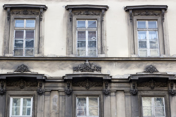 Fototapeta na wymiar Six vintage design windows on the facade of the old house.