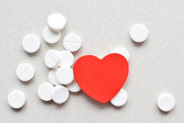 white tablets with red heart