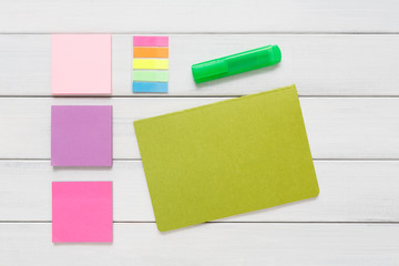 Flat lay of stationery supplies on rustic wood