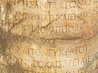 Ancient marble Hellenistic text column on the ruins of the ancient city of Side