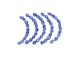 Soft blue violet tanzanite extra quality beads isolated on white background