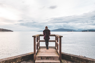 Girl at Pier at Jericho Beach Park in Vancouver, BC, Canada