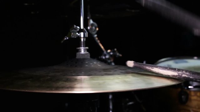 Drummer Playing Drums and Cymbals in Music Studio