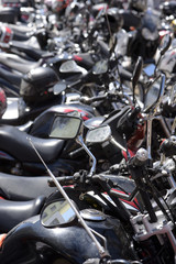 Visual chaos of motorcycle parking on the street