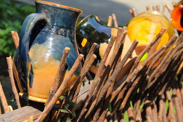 Clay jugs on the fence