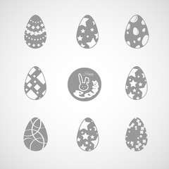 Vector collection of gray Easter eggs icons with different patterns on the gradient background.