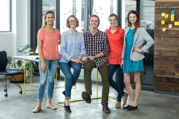 Smiling business executives standing in office