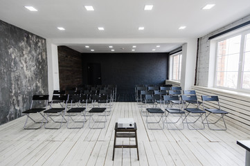 Modern university group study room with white desk and chairs