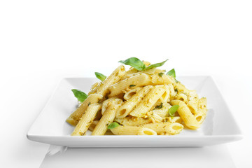 Plate with delicious pasta on white background