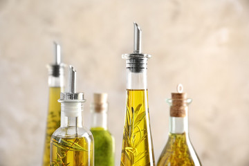 Composition of bottles with oil on blurred background