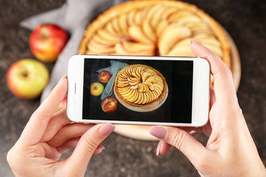 Blogger making photo of homemade apple pie, closeup