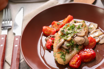 Tasty chicken marsala with mushrooms and tomatoes, closeup