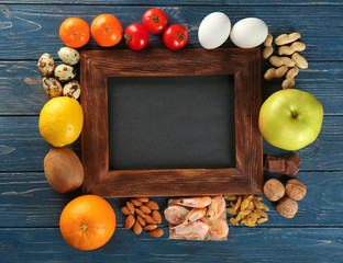 Allergic food with blank board on wooden background