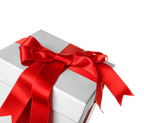 Beautiful gift box with red ribbon on white background