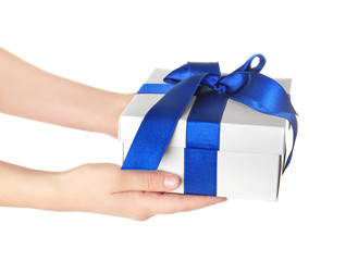 Hands holding beautiful gift box on white background