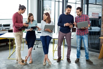 Business executives using digital tablet