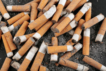 Closeup view of dirty cigarette butts