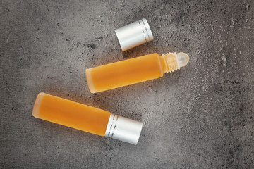 Bottles with perfume on grunge background